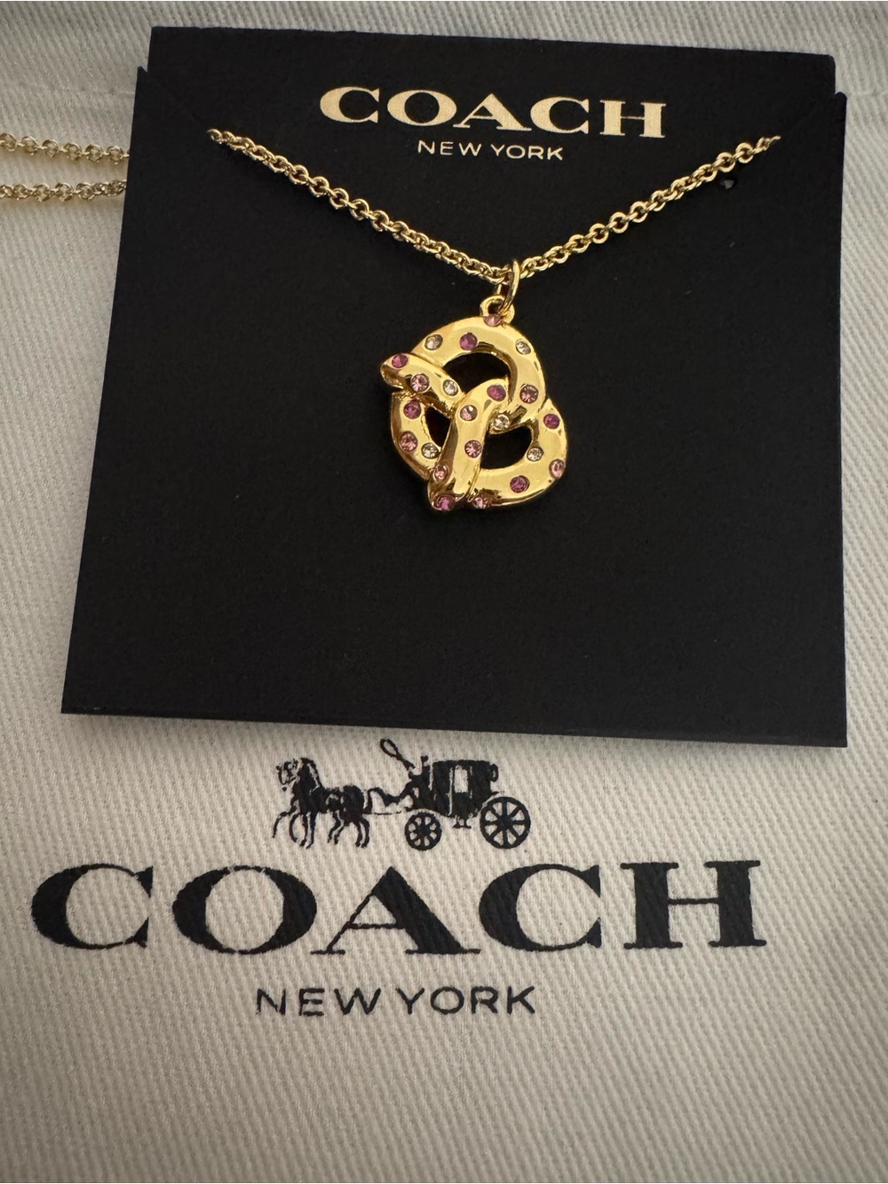 Coach Gold Pretzel Pendant Necklace with Pink Accents